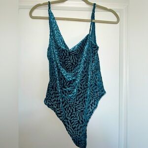 URBAN OUTFITTERS: blue velvet bodysuit, asymmetric neckline